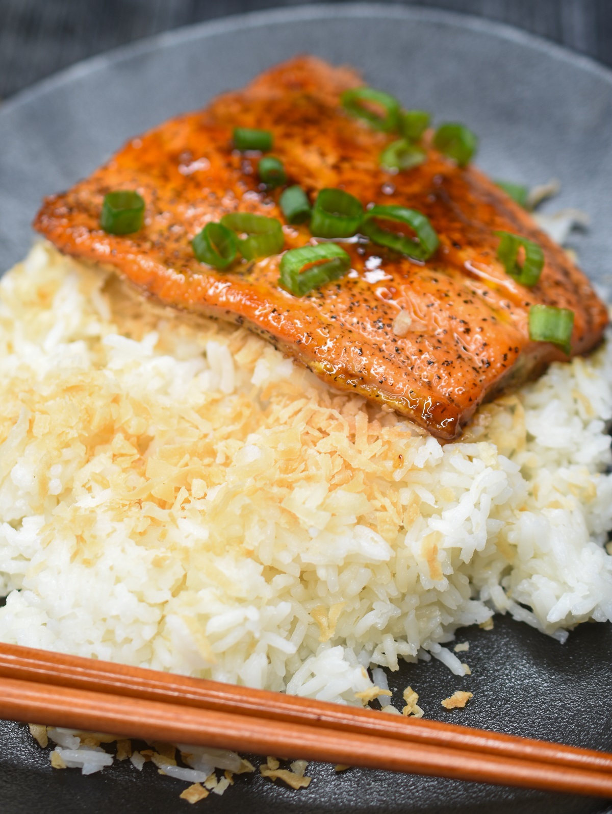 Coconut Rice. This  sweet rice recipe pairs well with salmon, tofu or a curry. Enjoy on its own as well. Also called Arroz Con Coco. Shown with a piece of sticky salmon.