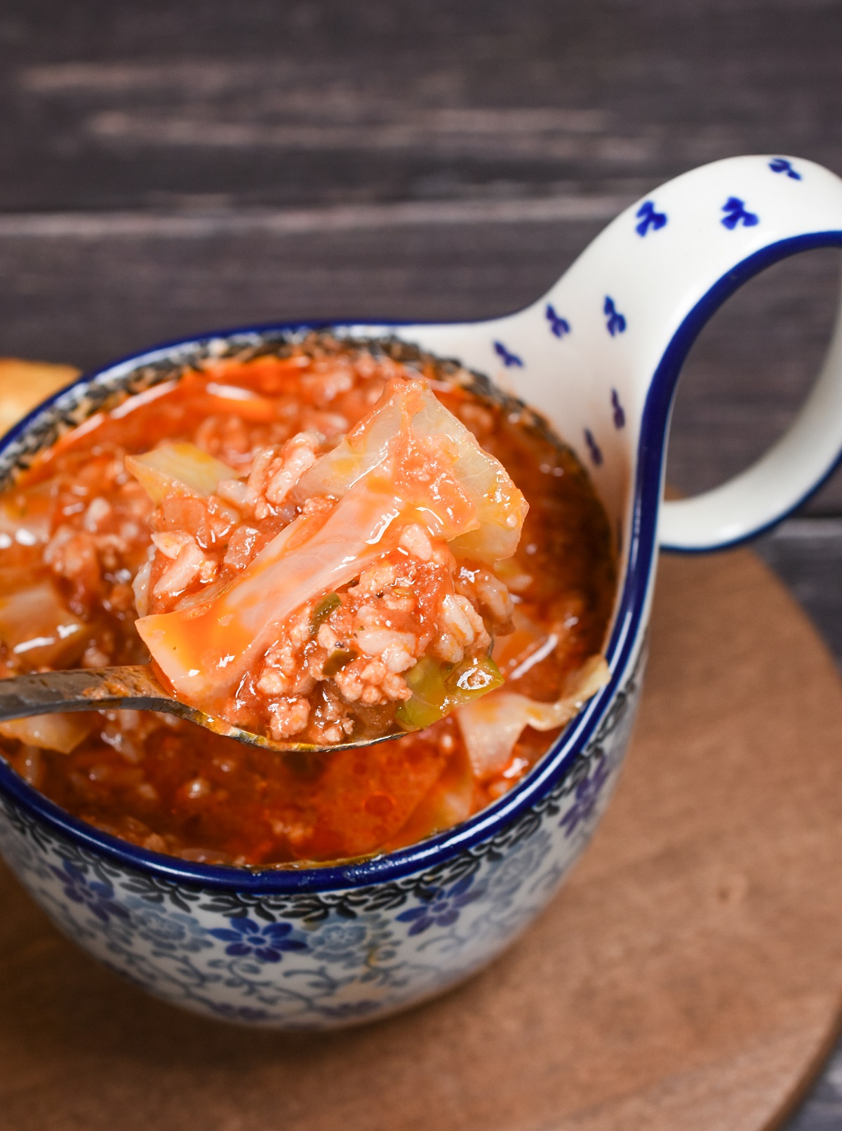 Unstuffed Cabbage Soup Recipe also called Golumpki Soup shown in a Polish Pottery Soup Bowl