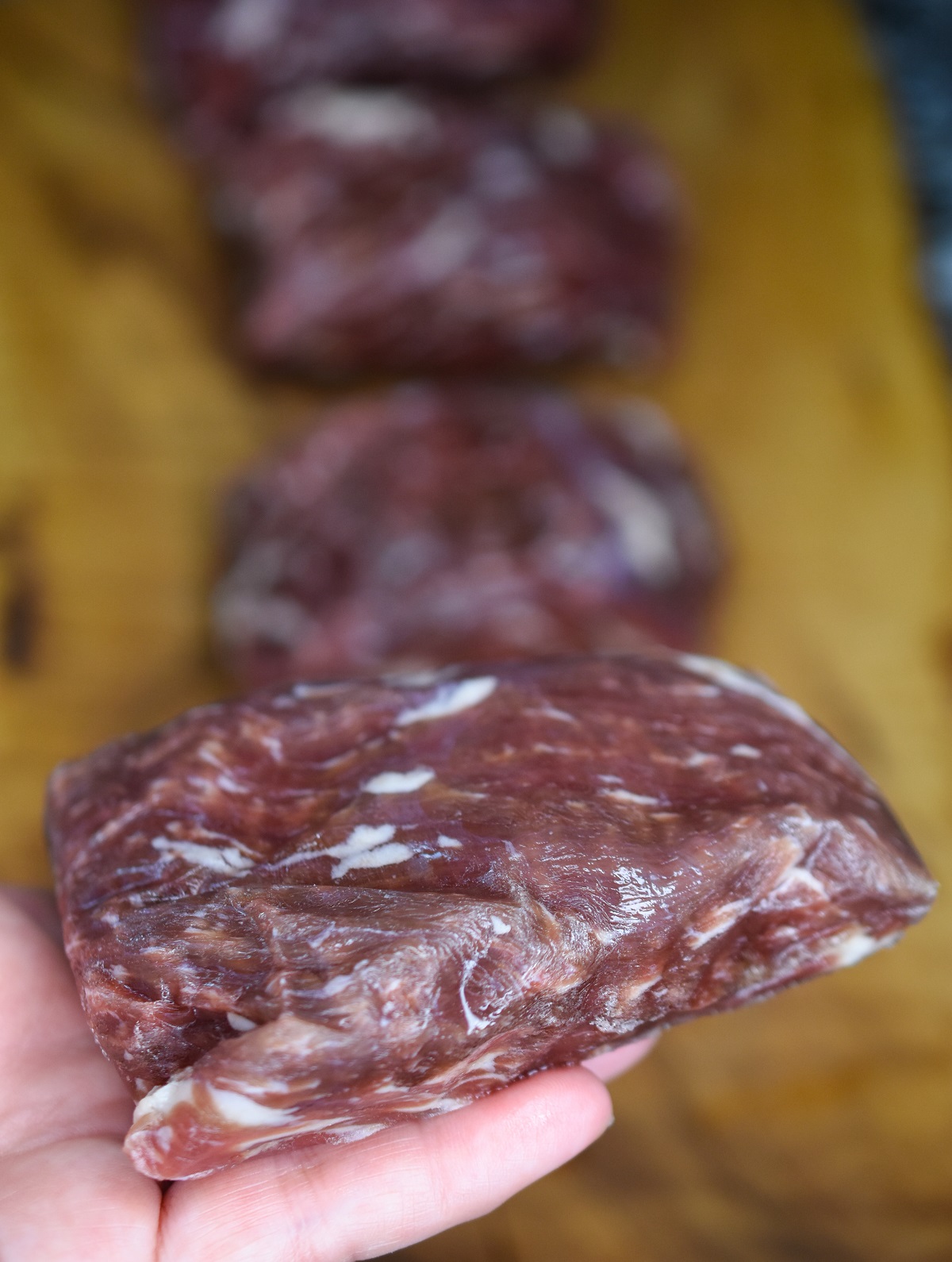 Bavette Steak also known as Flap Steak and Bavette de Boeuf (in France) is a rich, beefy cut of steak prized for its flavor, ease of cooking and price. Shown cut in 6 oz portions raw bavette steak.