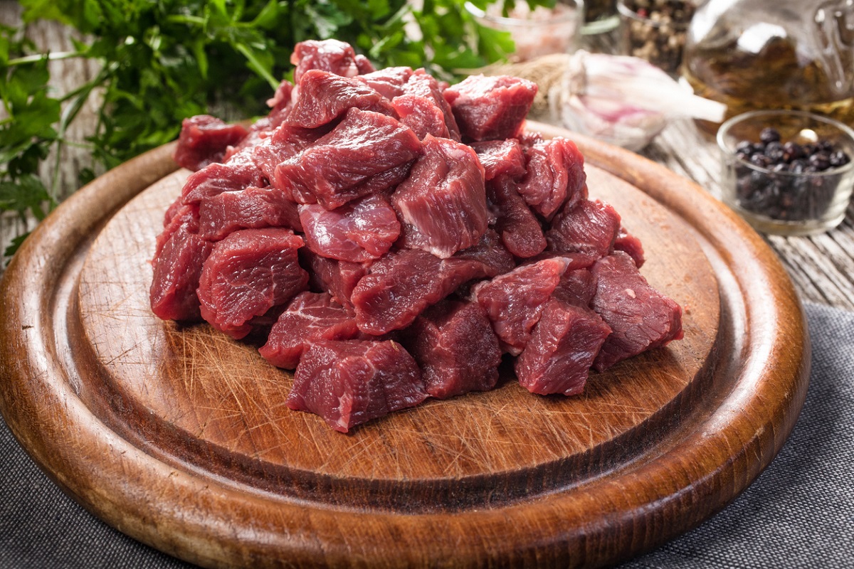Rae chunks of steak cut for making steak bites,