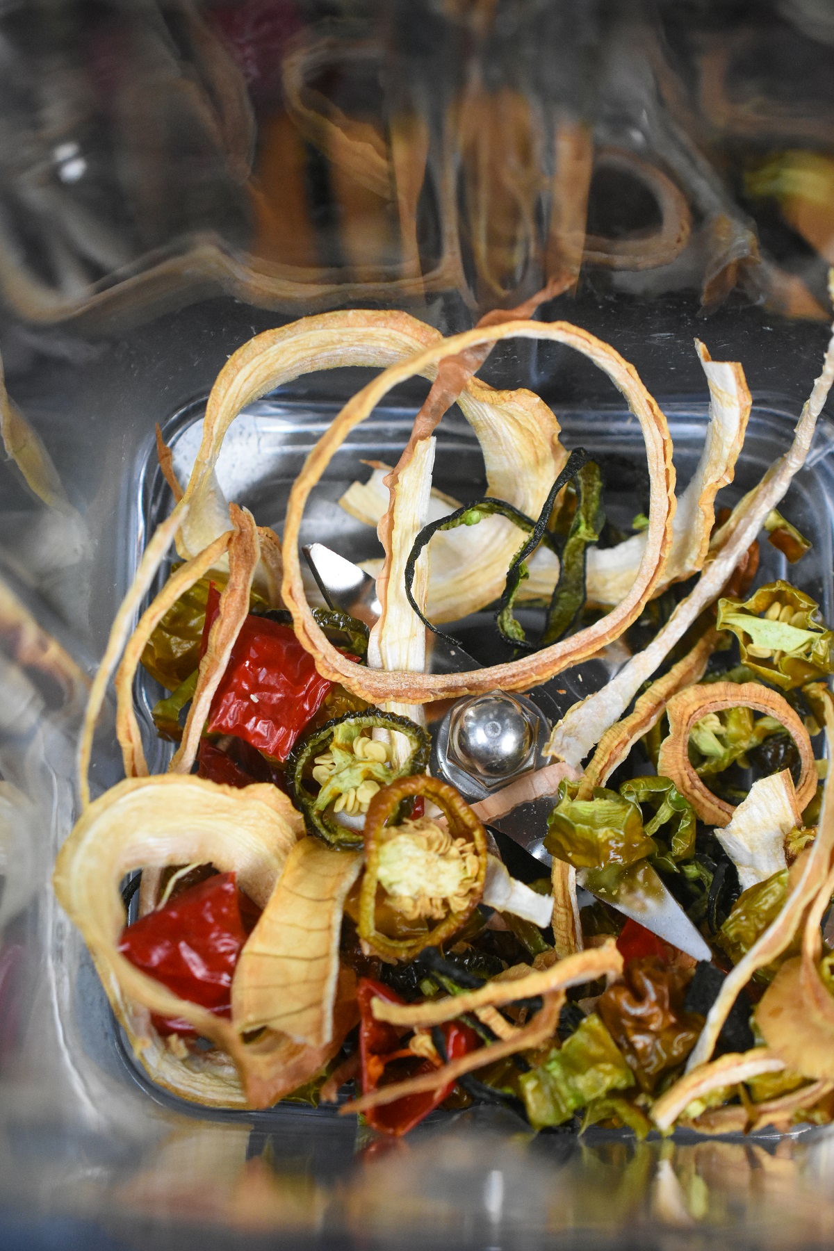 Fire Salt being made, shown dehydrated peppers and onions in a blender