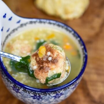 pastina soup with mini chicken meatballs in a bluie and white Polish pottery soup cup