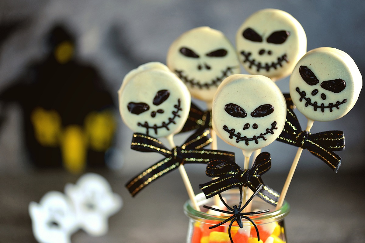 White chocolate dipped Oreo's on sticks with scary face made from melted chocolate